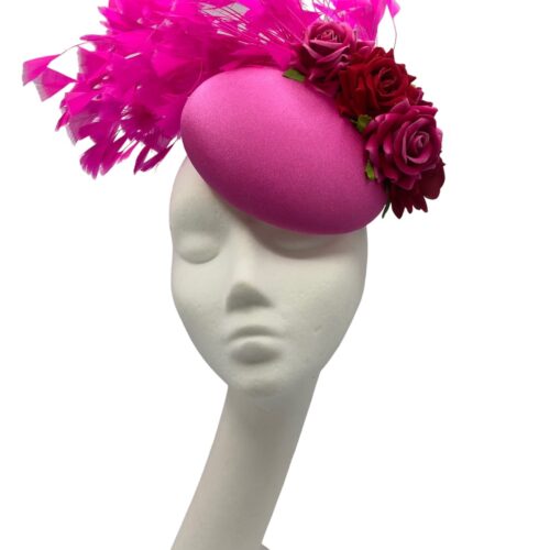 Stunning candy pink headpiece with matching pink feathers and red roses detail. 