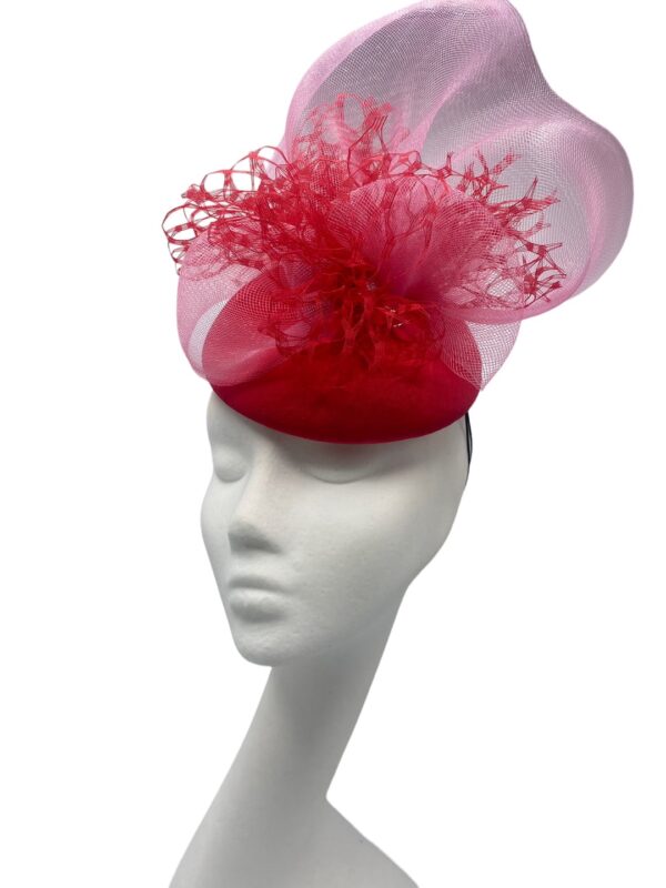 Stunning red headpiece with baby pink crin detail to finish.