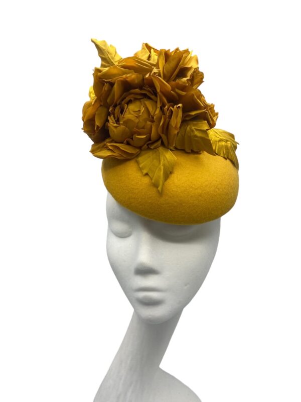 Gorgeous mustard felt based headpiece with a stunning array of handmade silk flower detail.