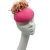 Stunning coral pink headpiece with complementary flowers and veiling to match.