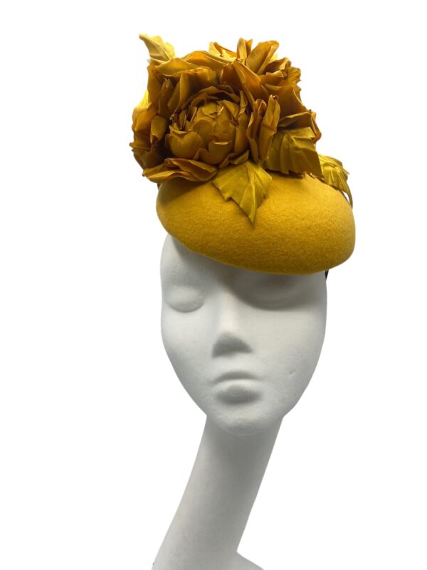 Gorgeous mustard felt based headpiece with a stunning array of handmade silk flower detail.