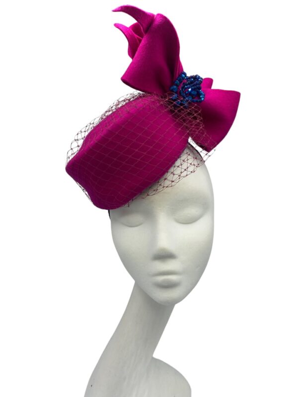 Fuschia pink felt Jackie Onassis inspired headpiece with stunning blue beaded detail.