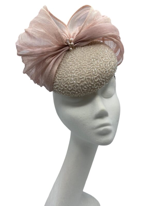Ice pink pillbox headpiece with hand beaded overlay and beautiful nude/pink silk abaca bow detail.