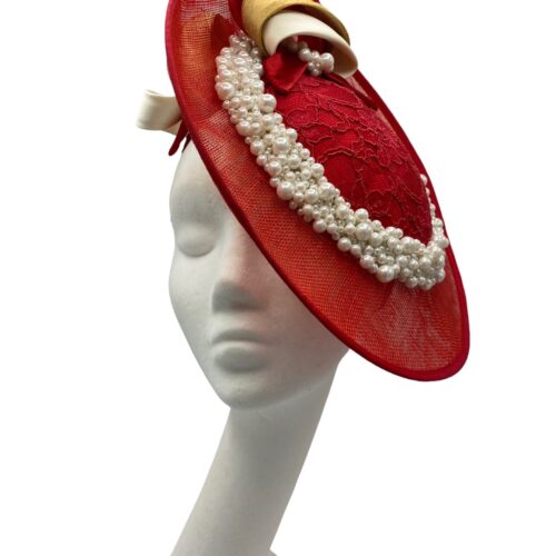 Red side saucer headpiece with pearl encrusted trim and finished with ivory/gold and red swirl detail.