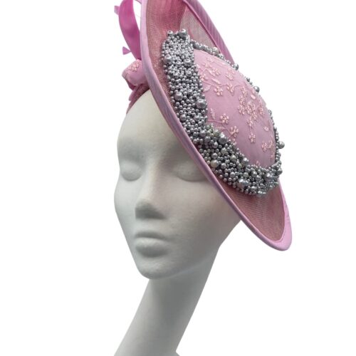 Pink side saucer headpiece with stunning grey/silver beaded detail, finished with stunning matching pink feather.