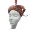 Stunning pink tweed hat with matching swirl detail. This headpiece has some colour through the tweed fabric.