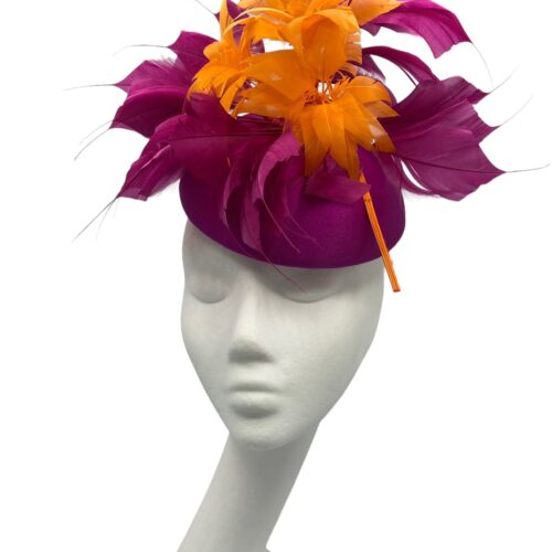 Stunning magenta pink headpiece with matching magenta and orange feather structure detail.