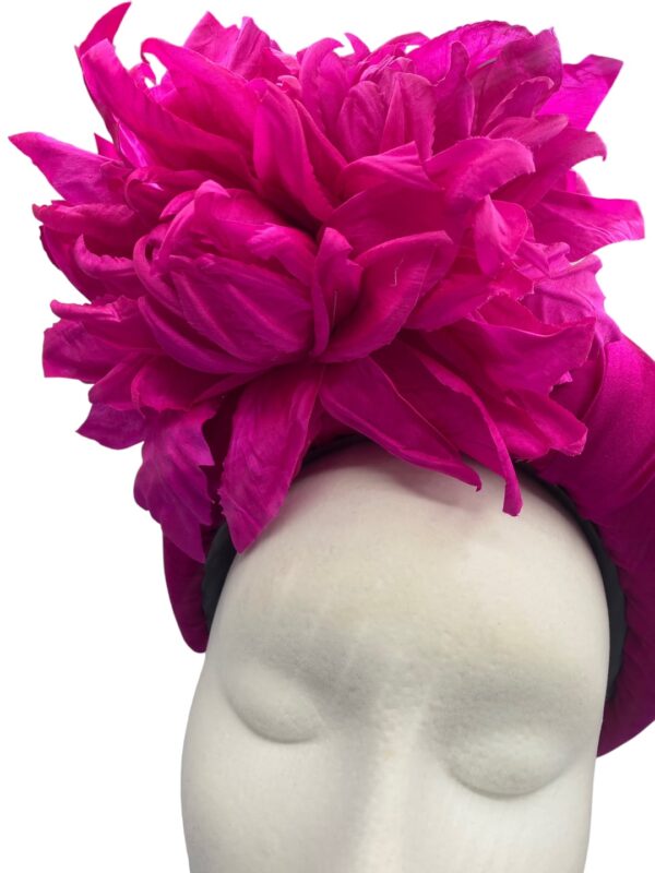 Vibrant pink headpiece crown with matching handmade silk flower detail to finish.