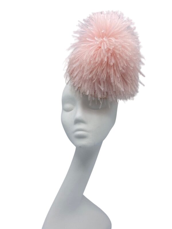 Stunning quirky baby pink small headpiece with floaty ostrich feather detail.