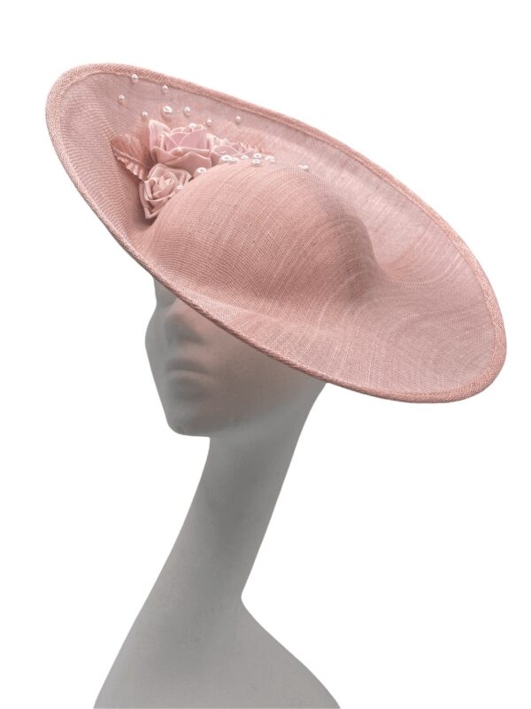 Large side saucer pink/peach tone headpiece with stunning flower detail, headpiece is on a headband.