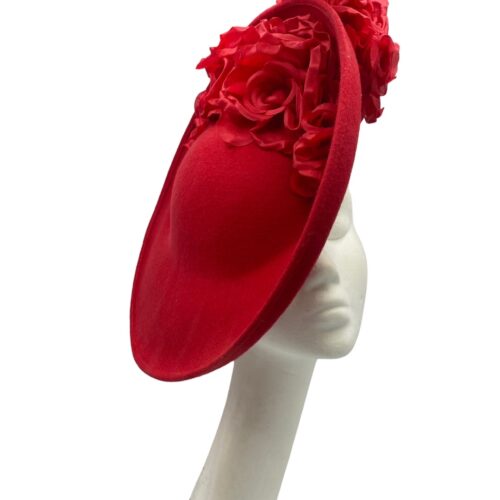 Large red felt side saucer headpiece with headband to secure, finished with red flower detail.