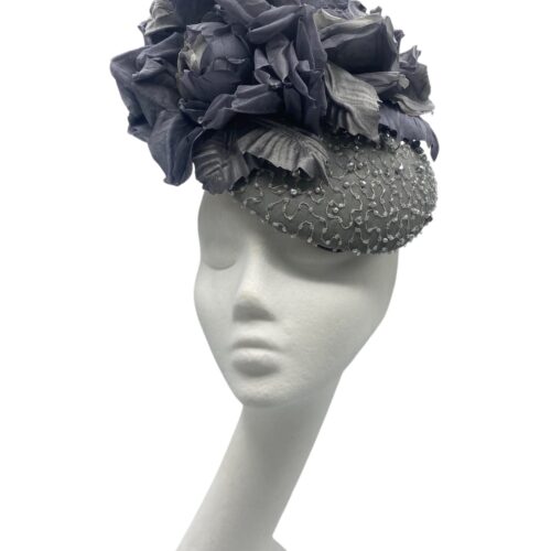 Stunning grey hand beaded headpiece with handmade silk petal flower detail.