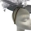 Stunning silver/grey side saucer headpiece on a headband, complete with a stunning array of feathers.