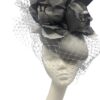 Large silver/grey headpiece with flower and veiling detail to finish.