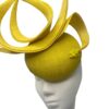 Yellow headpiece with structured swirl detail, small yellow bead detail to the base of the swirl.