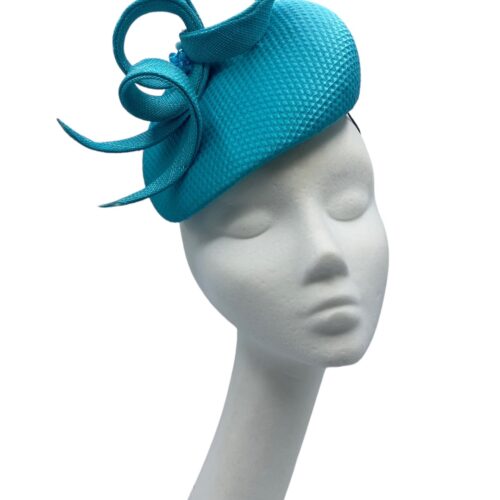 Stunning teal/turquoise headpiece with beaded structured detail.