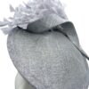 Stunning silver/grey side saucer headpiece on a headband, complete with a stunning array of feathers.