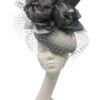 Large silver/grey headpiece with flower and veiling detail to finish.
