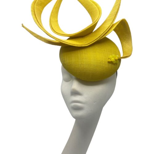 Yellow headpiece with structured swirl detail, small yellow bead detail to the base of the swirl.