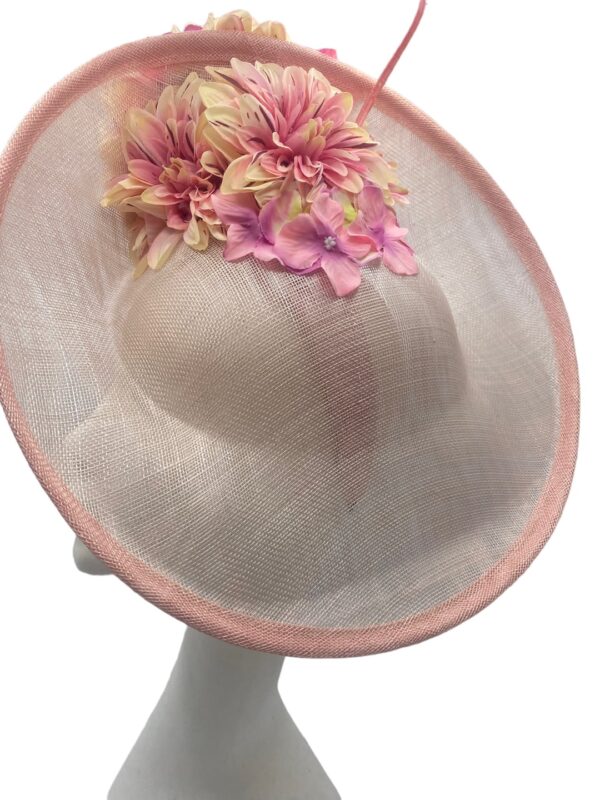 Pink side saucer headpiece on a headband with stunning flower detail.