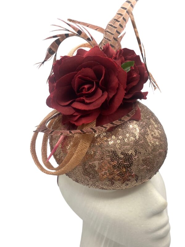 Rose gold sequinned headpiece with burgundy flowers & feather detail to finish.