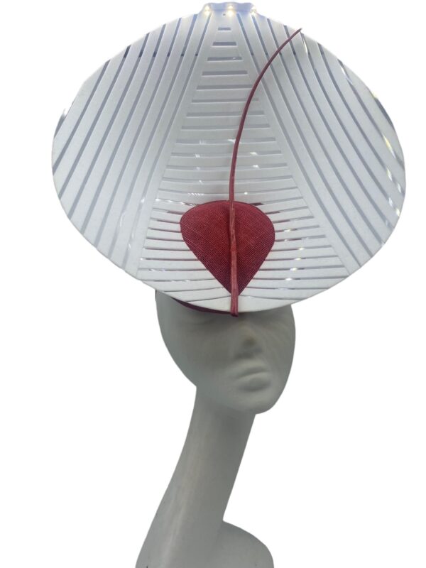 Stunning headpiece with red sinamay base and white/clear vinyl structure.