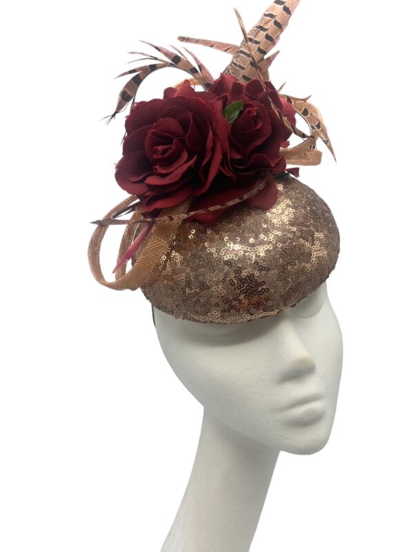 Rose gold sequinned headpiece with burgundy flowers & feather detail to finish.