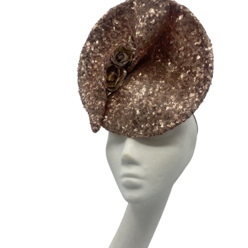 Rose gold sequinned percher headpiece with swirl detail to the top.