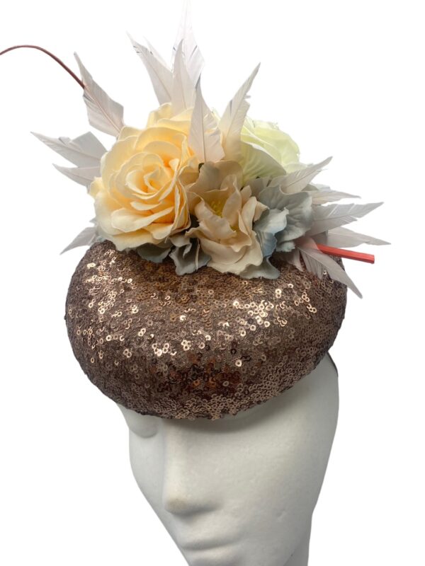 Rose gold sequinned headpiece with flowers.