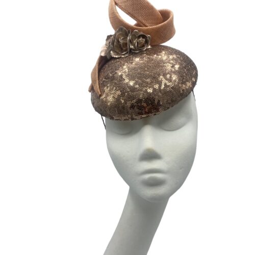Rose gold sequinned headpiece with swirl detail to the top.