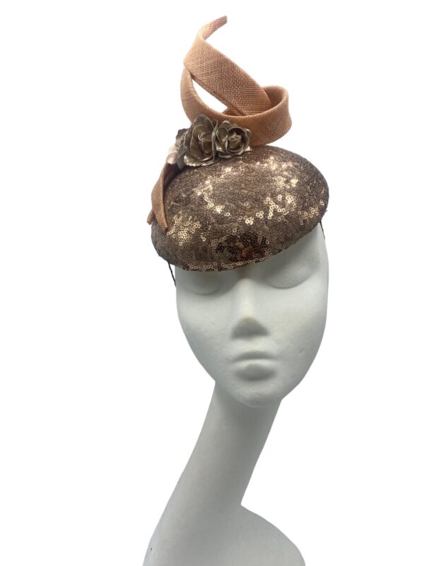 Rose gold sequinned headpiece with swirl detail to the top.