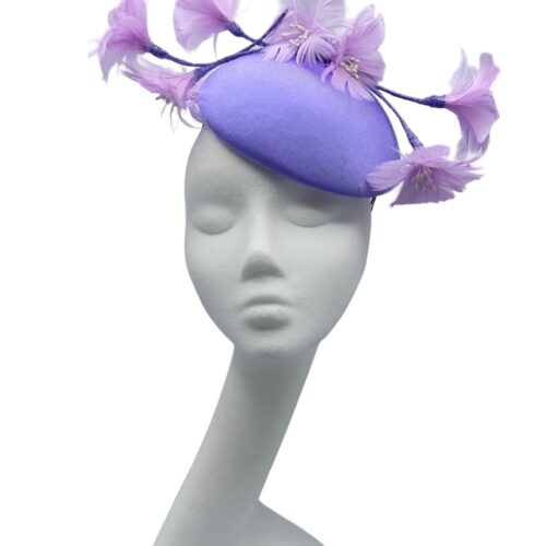 Fabulous lilac headpiece with quirky baby pink flower detail.