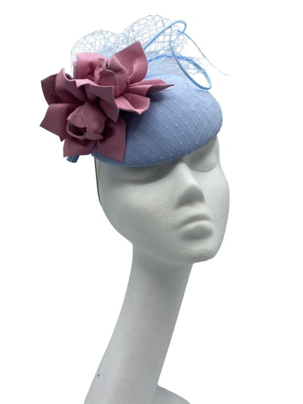 Baby blue headpiece with pink leather flower detail.