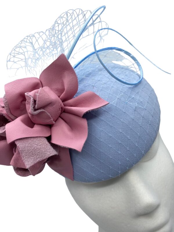 Baby blue headpiece with pink leather flower detail.