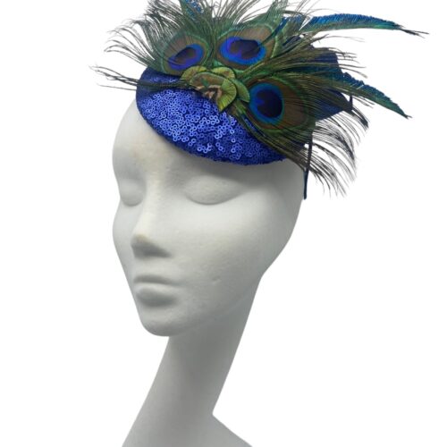Blue sequinned headpiece on a headband with stunning peacock feather detail.