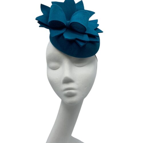 Stunning teal felt small headpiece with simple detail to finish.