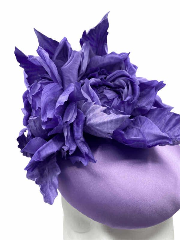 Lilac satin headpiece with handmade silk purple flower detail.