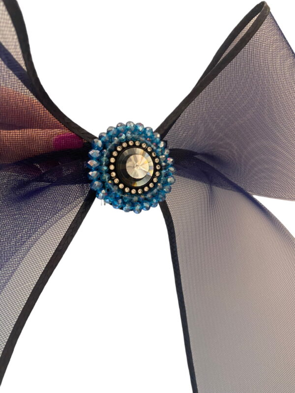 Navy Bow Headpiece with comb detail which fixes in place to the back of the head for the bow to attach.