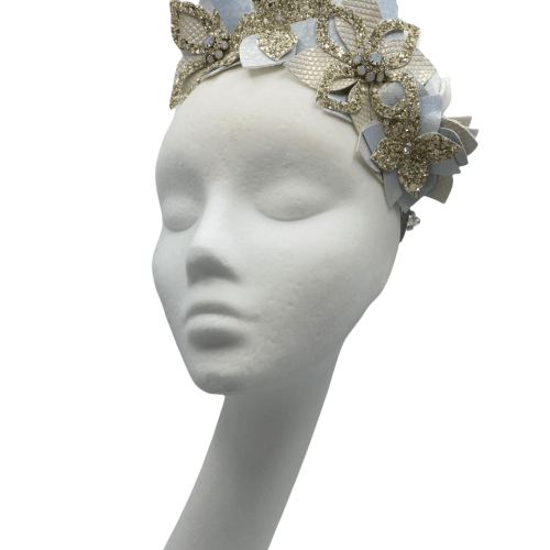 Baby blue ice flower crown with irridescent and champagne gold glitter detail.