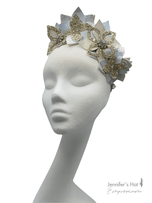 Baby blue ice flower crown with irridescent and champagne gold glitter detail.